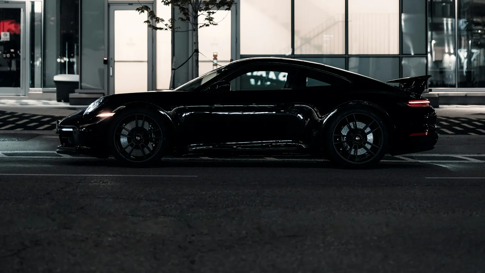Black sports car with dark windows